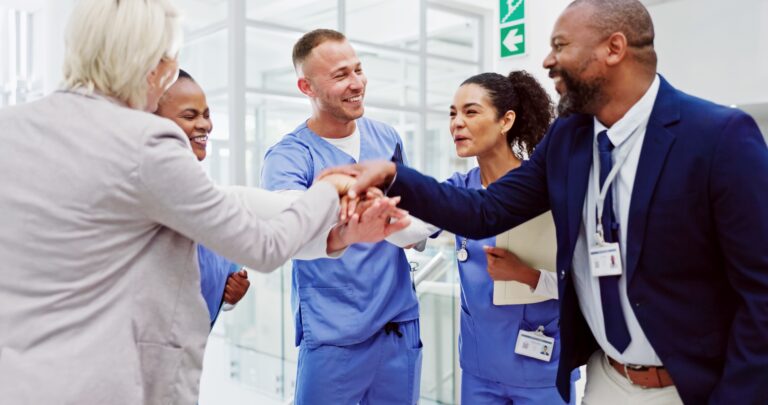 Collaboration,,Healthcare,And,Huddle,With,Hospital,Manager,Speaking,To,Staff