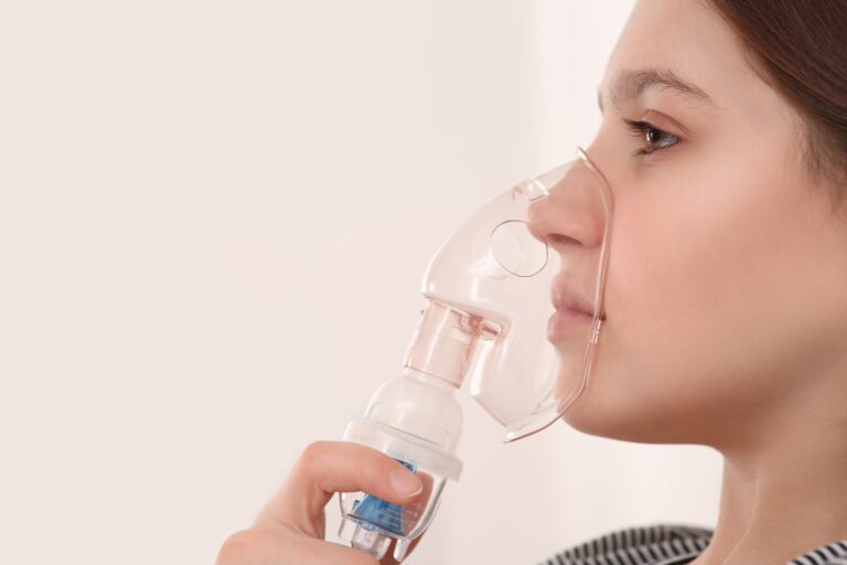 Cute,Girl,Using,Nebulizer,For,Inhalation,On,White,Background,,Closeup.