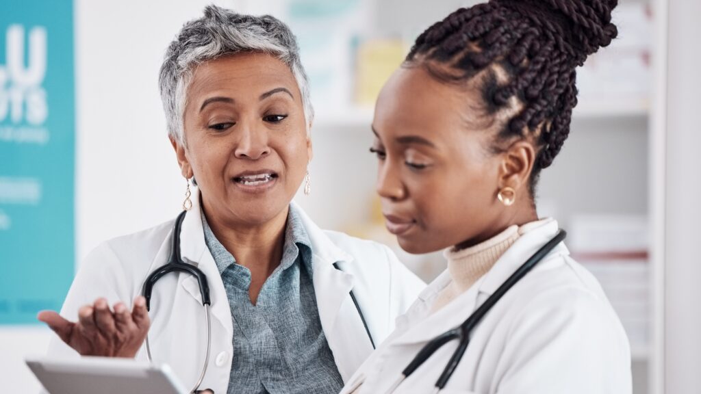 two women talking over ipad