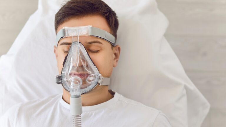 guy with sleep apnea mask on