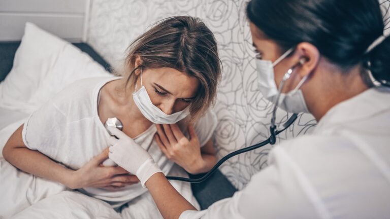 women in hospital with mask