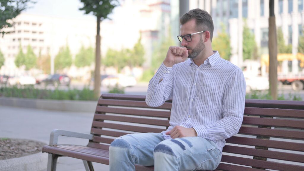 adult coughing outside, hot dry air